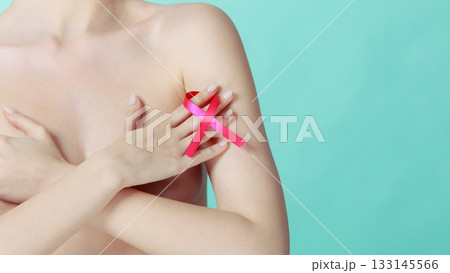 Naked woman with breast cancer awareness ribbon 133145566
