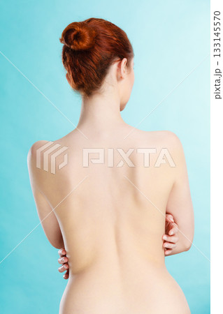 Young woman with naked back 133145570
