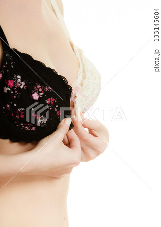 Lady with choice trying to choose perfect bra. 133145604