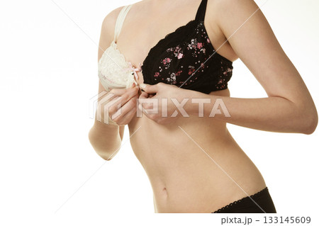 Girl of smooth body with brassiere dilemma. Girl of smooth body with brassiere dilemma. 133145609