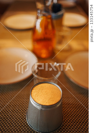 Enjoying a cozy meal with unique table setting 133145754