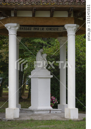 Pieta statue in the garden of Basilique Notre-Dame-de-Buglose in France 133145881