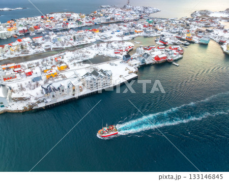 Aerial view of fishing boat in blue sea and snowy islands Aerial view of fishing boat in blue sea and snowy islands 133146845
