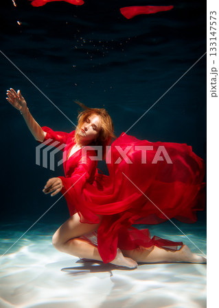 Dreamlike underwater setting featuring performer as mermaid 133147573