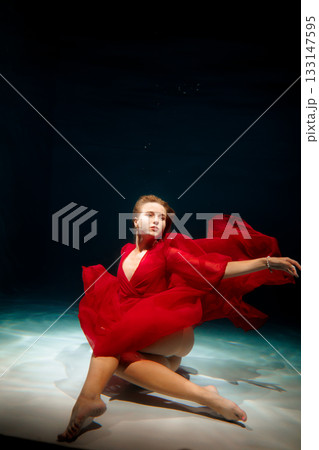 Majestic water ballet featuring energetic dancer with flowing 133147595