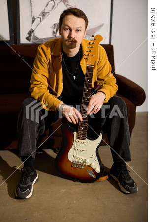 Detail shot of guitarist immersed in musical emotion and style Detail shot of guitarist immersed in musical emotion and style 133147610