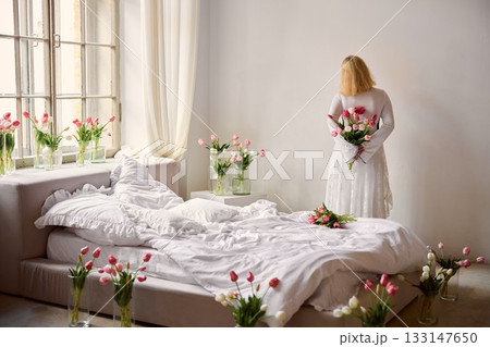 Sunshinefilled chamber decorated with blooming tulips and warm Sunshinefilled chamber decorated with blooming tulips and warm 133147650