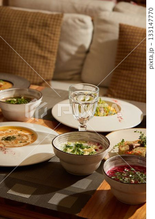 Enjoy gourmet soups paired with refreshing beverages to enhance your dining experience 133147770