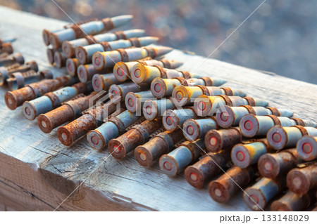 old rusty cartridges in a machine-gun belt. war in Ukraine. military ammunition 133148029