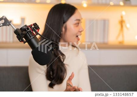 Podcast Discussion. Engaging conversation between two women in a cozy studio setting. 133148657