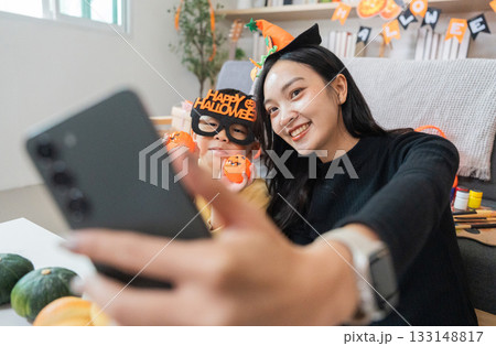 Halloween Selfie. A mother and son take a fun selfie with Halloween costumes and decorations. Halloween Selfie. A mother and son take a fun selfie with Halloween costumes and decorations. 133148817