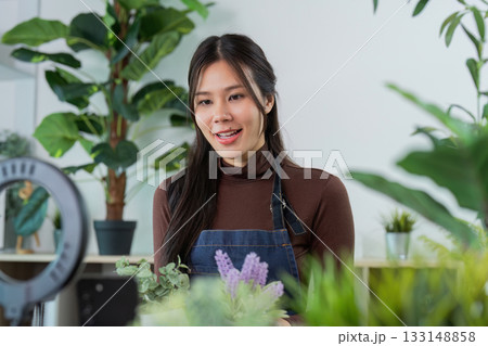 Customer Engagement. Woman speaking to a camera in a plant shop. Customer Engagement. Woman speaking to a camera in a plant shop. 133148858