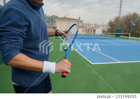 Close Up Of A Tennis Player Preparing To Return A Shot On A Blue Tennis Court Close Up Of A Tennis Player Preparing To Return A Shot On A Blue Tennis Court 133149283