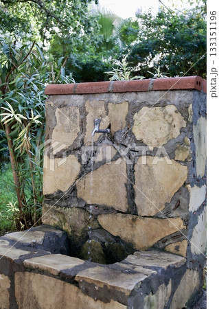 Stone garden fountain. High quality photo Stone garden fountain. High quality photo 133151196