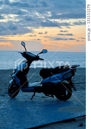 Scooter beach sunset. High quality photo 133151279