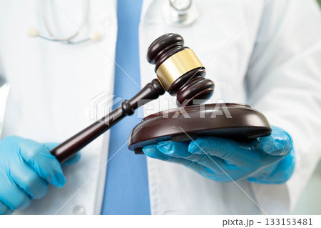Doctor holding judge gavel, medical law and crime justice. 133153481