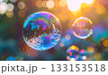 Iridescent soap bubbles float in sunlight 133153518