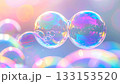 Rainbowhued bubbles glisten in a dreamlike world 133153520