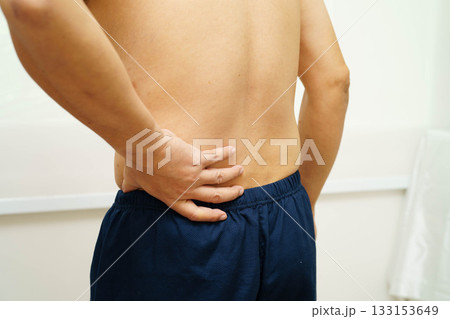 Asian man pain back muscle, spine and bone from accident. Asian man pain back muscle, spine and bone from accident. 133153649