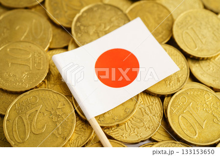 Japan flag on coin and banknote money, finance trading investment business currency concept. Japan flag on coin and banknote money, finance trading investment business currency concept. 133153650