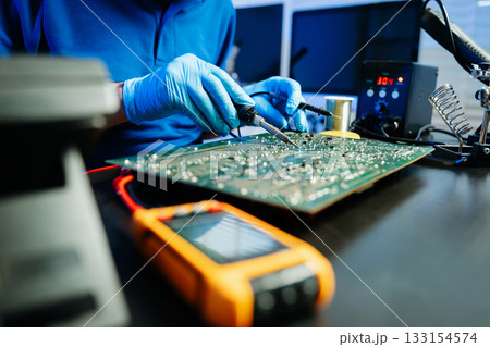 Electronics technician, electronic engineering electronic repair, electronics measuring and testing, repair and maintenance concepts. Electronics technician, electronic engineering electronic repair, electronics measuring and testing, repair and maintenance concepts. 133154574