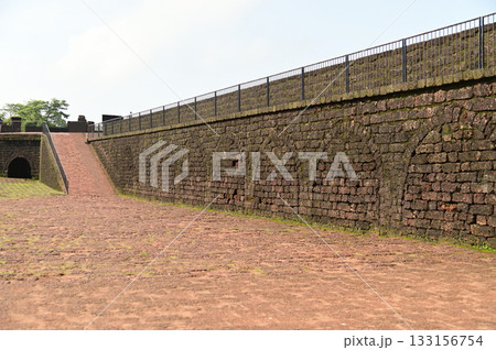 Aguada Fort is a built in 1612 along with a lighthouse, located on Sinquerim Beach in Goa, India, overlooking the Arabian Sea. The fort is a major tourist attraction. 133156754