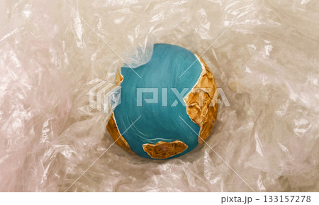 Globe wraped by Plastic materials. Environmental Issue Concept Globe wraped by Plastic materials. Environmental Issue Concept 133157278