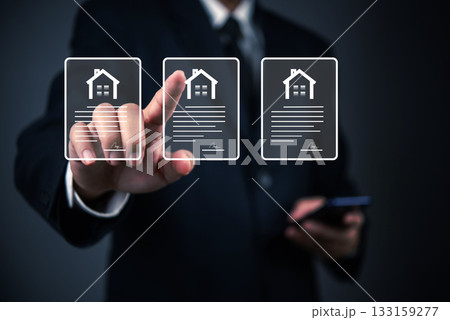 Real estate agent using virtual interface to select property documents, digital housing contracts mortgage apps and smart transactions. Real estate agent using virtual interface to select property documents, digital housing contracts mortgage apps and smart transactions. 133159277