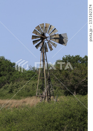 Kansas Windmill in the country with blue sky outdoor Kansas Windmill in the country with blue sky outdoor 133162374