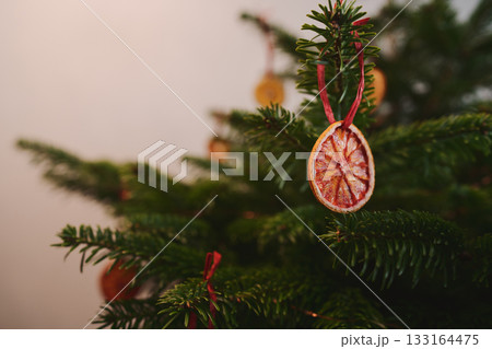 Closeup small christmas tree with natural decorations indoor 133164475
