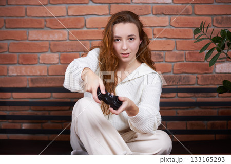 A gamer plays a game A gamer plays a game 133165293