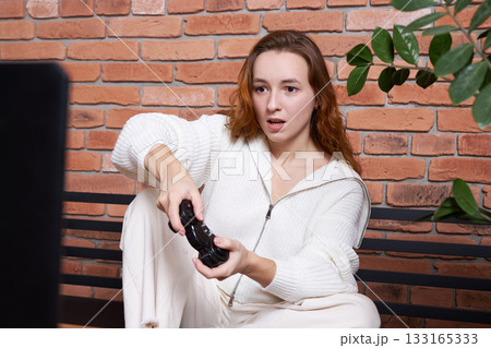 A gamer plays a game 133165333