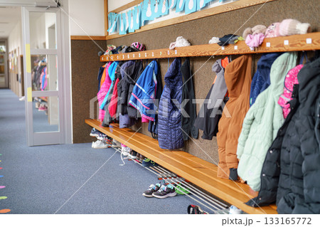 clothes on a rack in a shop clothes on a rack in a shop 133165772
