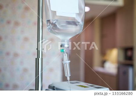 Close up medical intravenous IV drip in hospital background 133166280