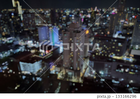 Abstract blur cityscape skyline building night light bokeh background 133166296