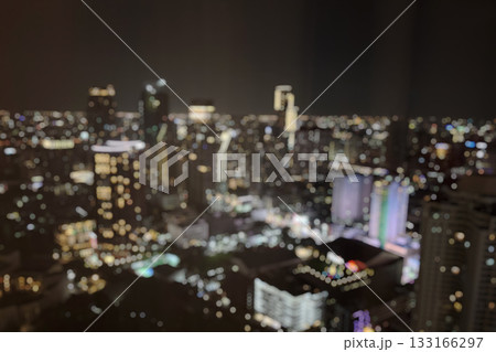 Abstract blur cityscape skyline building night light bokeh background Abstract blur cityscape skyline building night light bokeh background 133166297