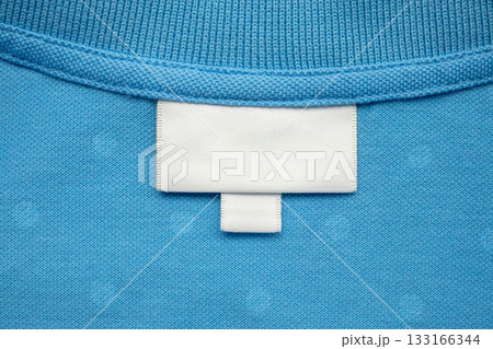 White blank laundry care clothes label on shirt fabric background 133166344
