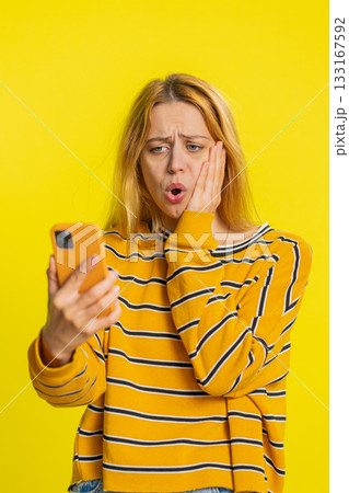 Upset sad woman use smartphone play game loses loss fail unlucky news bad lottery results crisis 133167592