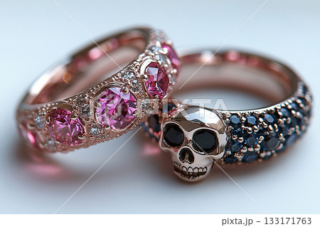 Pair of gold wedding rings with a bold pattern on a white background. Original design. 133171763