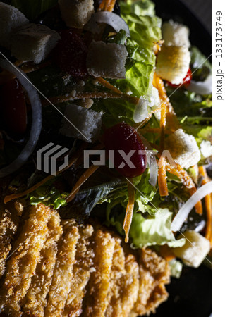 Cross Up Fried Chicken Salad With Mixed Veggies, A vibrant ad photo of crispy fried chicken atop a colorful mixed veggie salad, perfect for a healthy food or fresh fusion documentary. Cross Up Fried Chicken Salad With Mixed Veggies, A vibrant ad photo of crispy fried chicken atop a colorful mixed veggie salad, perfect for a healthy food or fresh fusion documentary. 133173749
