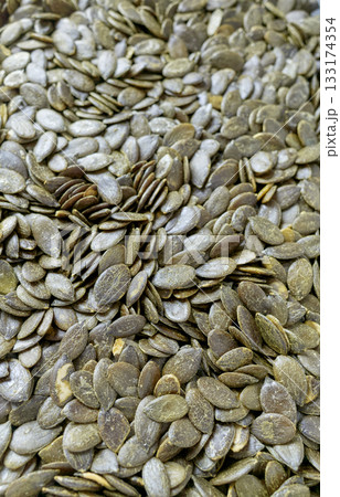 Close up of pumpkin seeds, selective focus. Close up of pumpkin seeds, selective focus. 133174354