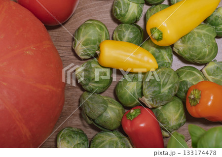 Close-up of various vegetables in a cozy kitchen setting 133174478