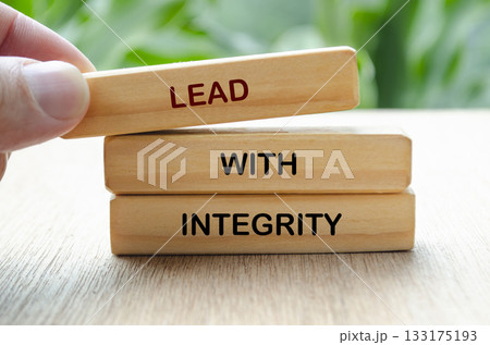 Lead with integrity text on wooden blocks. Leadership concept 133175193