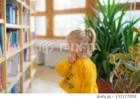 happy little boy in school library 133177058