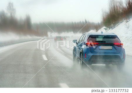 car on road in winter car on road in winter 133177732