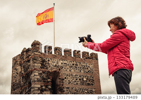 Tourist with camera on Sohail Castle in Fuengirola, Spain 133179489