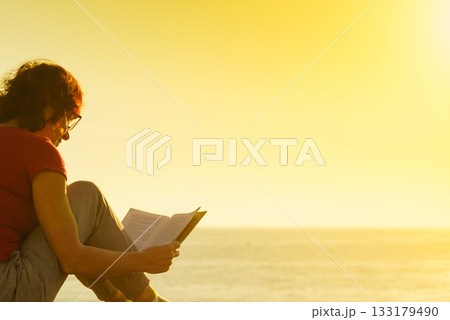 Woman on sea read book, relaxing Woman on sea read book, relaxing 133179490