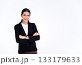Portrait of beautiful businesswoman smiling standing and looking at the camera while arms crossed isolated on white background. 133179633