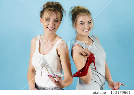 Women presenting high heels shoes 133179661