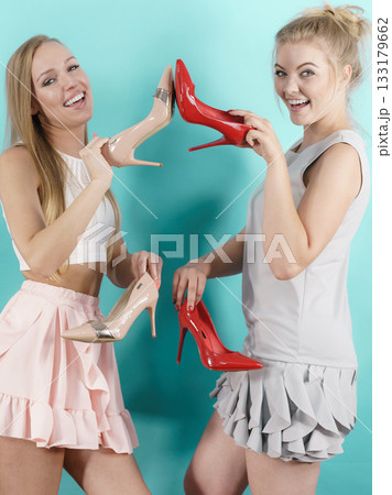 Women presenting high heels shoes 133179662